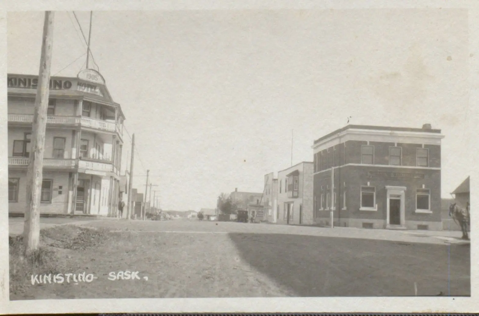 Street view with Kinistino Hotel and brick bank building